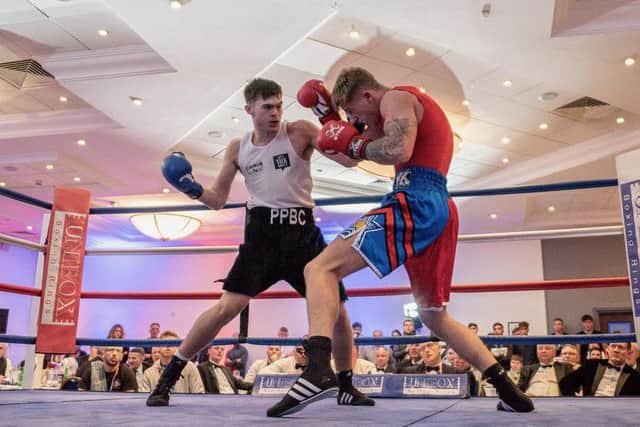Brian Lawless in action against Kingsley Hobbs.