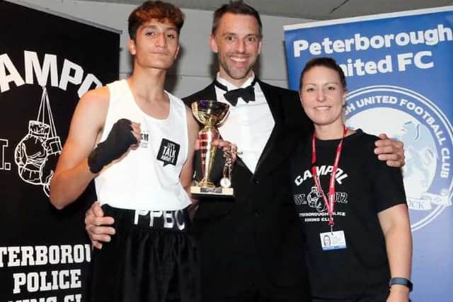 Ali Raja with Cambs Police assistant chief constable Dan Vajzovic and coach Vicki Baker.