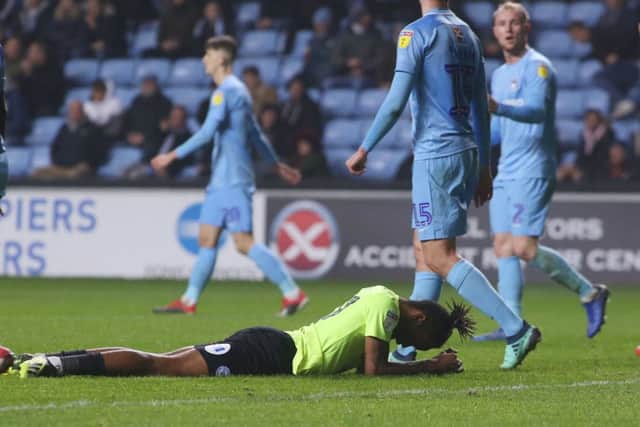Posh striker Ivan Toney (on floor) can't believe he's missed a simple headed chance at Coventry. Photo: Joe Dent/theposh.com.
