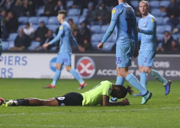 Posh striker Ivan Toney (on floor) can't believe he's missed a simple headed chance at Coventry. Photo: Joe Dent/theposh.com.