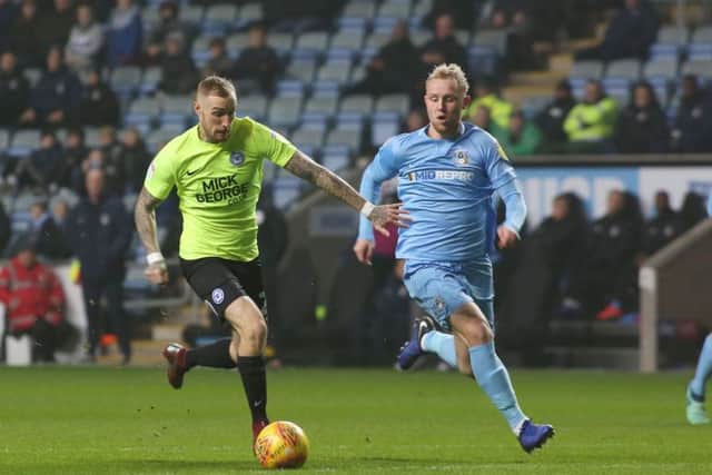 Posh winger Marcus Maddison is tracked  by Coventry's Jack Grimmer. Photo: Joe Dent/theposh.com.