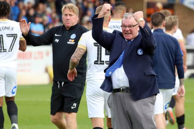 Posh manager Steve Evans celebrates an away win at Southend this season.