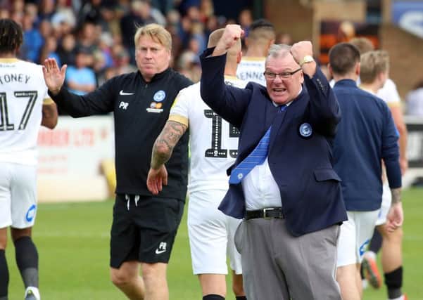 Posh manager Steve Evans celebrates an away win at Southend this season.