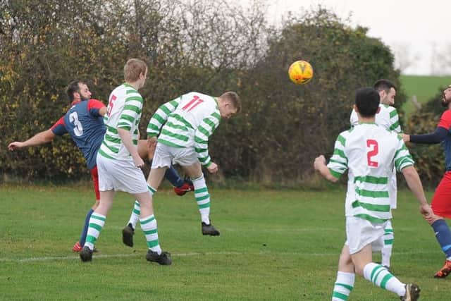 Action from a Peterborough League Division One match between Eye (green) and Wittering Harriers. Wittering won 5-1. Photo: David Lowndes.