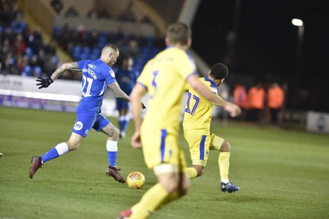 Marcus Maddison just before he scores for Posh against Wimbledon. Photo: David Lowndes.