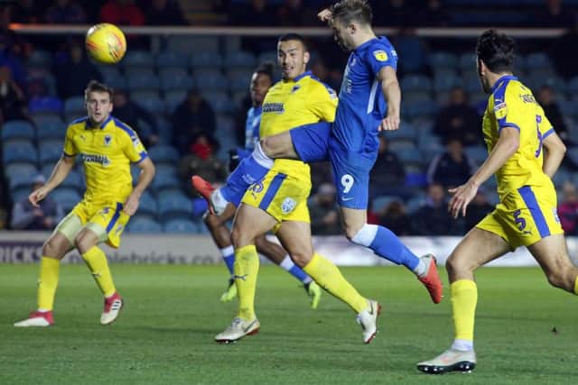 Posh striker Matt Godden volleys a decent scoring chance over the bar against Wimbledon. Photo: Joe Dent/theposh.com.