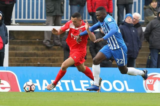 Stamford's Kern Miller (red) scored his penalty in a shootout defeat against Barwell in the FA Trophy.