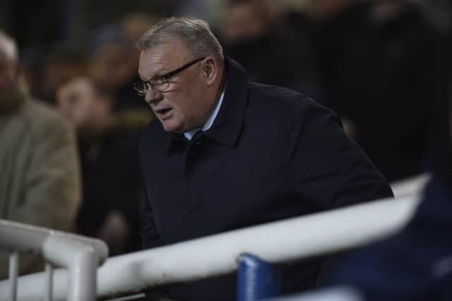 Steve Evans watches Posh v Wimbledon from the ABAX Stadium directors box. Photo: David Lowndes.