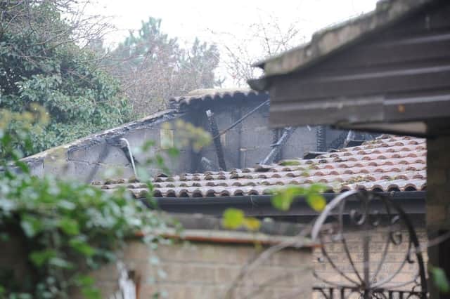 Parnwell house with burnt out roof after house fire. EMN-181127-151135009