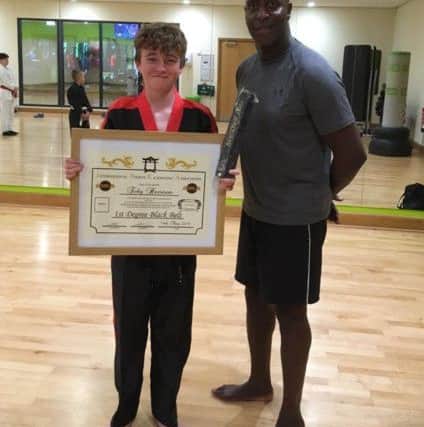 Clifton Findley with black belt Toby Harrison.