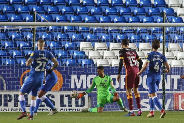 Posh 'keeper Aaron Chapman can't prevent Bradford City's equaliser at Posh. Photo: Joe Dent/theposh.com.