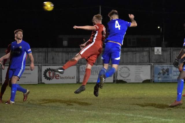 Paul Malone (4) heads home one of his three goals for Peterborough Sports against Dunstable. Photo: James Richardson.