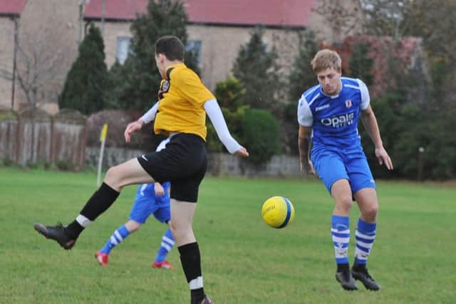 Action from Glinton & Northborough's 1-0 win over Orton Rangers (blue) in Peterborough League Division Four. Photo: David Lowndes.
