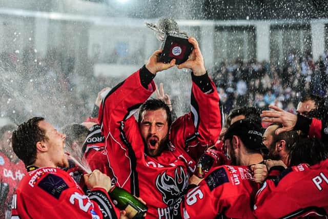 James Ferrara lifts the English Premier League play-offs trophy in 2015.