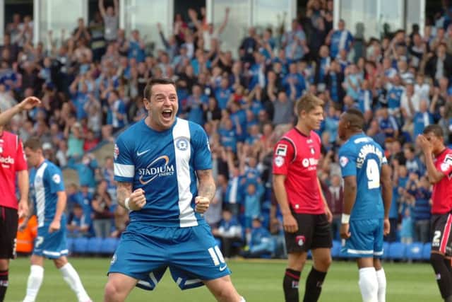 Lee Tomlin celebrates a Posh goal.