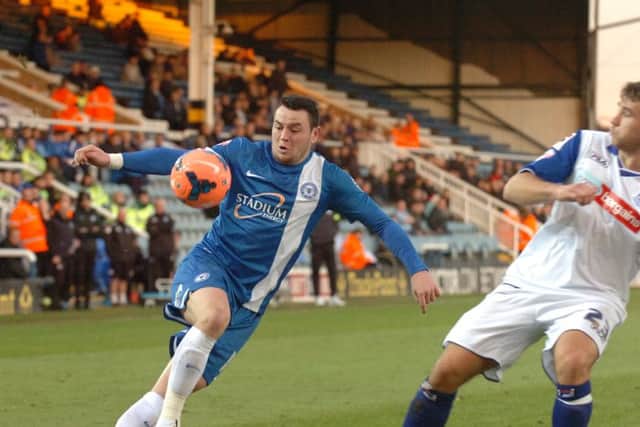 Lee Tomlin in action for Posh.