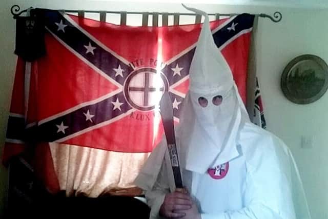 Adam Thomas andClaudia Patatas also posed with their newborn son standing next to a Swastika flag while wearing Ku Klux Klan robes. SWNS.