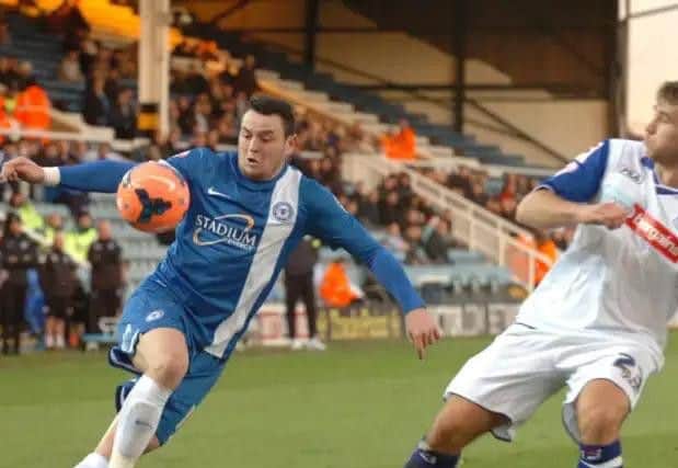 Lee Tomlin in action for Posh