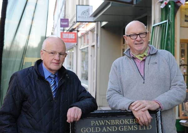 John Drewnicki, left, retiring chairman of the Cowgate retailers with new chairman Chris Fuller EMN-181217-153415009