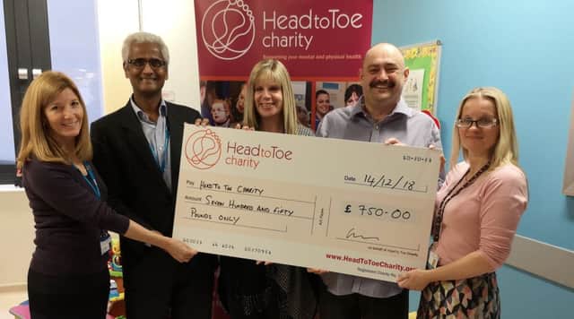 Dr Ges Gregory, Dr Venkat Reddy and Angie Grannell from CPFT receive the donation from John Ravenscroft and Natasha Leahy from Family Voice Peterborough