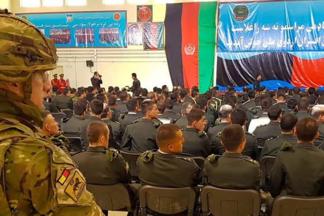 Servicemen and women are briefed ahead of a mission