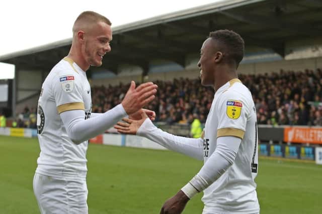 Posh players Joe Ward (left) and Siriki Dembele have enjoyed a decent first half of the season.
