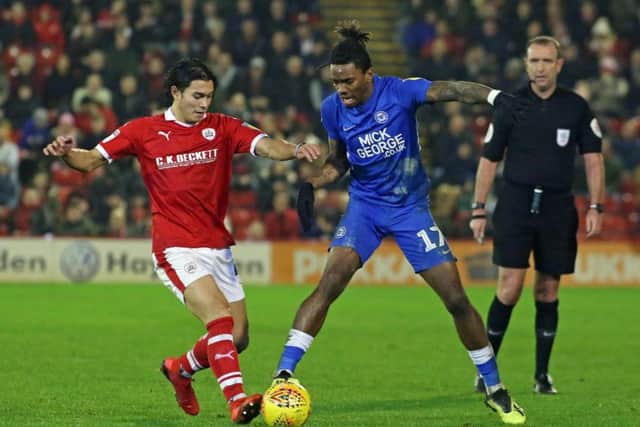 Posh striker Ivan Toney with Barnsley's Kenny Dougall. A clash between these players caused great controversy.  Photo: Joe Dent/theposh.com.