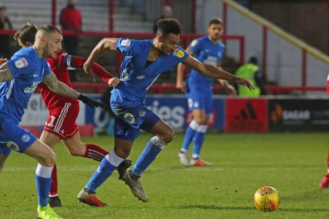 Posh goalscorer Rhys Bennett surges out of defence with the ball at Accrington. Photo: Joe Dent/theposh.com.