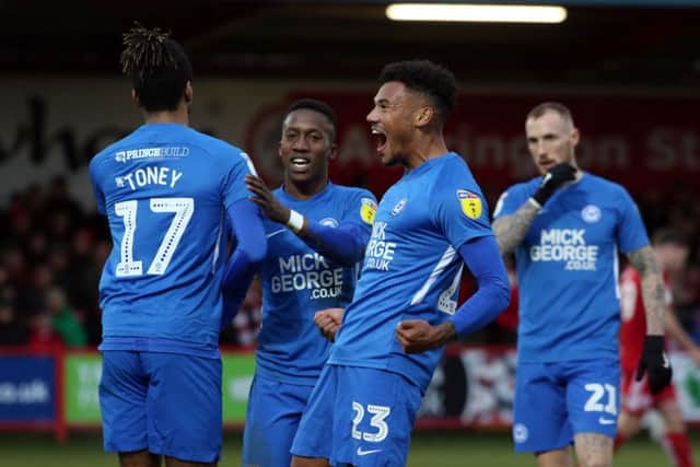 Tyler Denton (right) celebrates with Posh striker Ivan Toney after the opening goal at Accrington. Photo: Joe Dent/theposh.com.