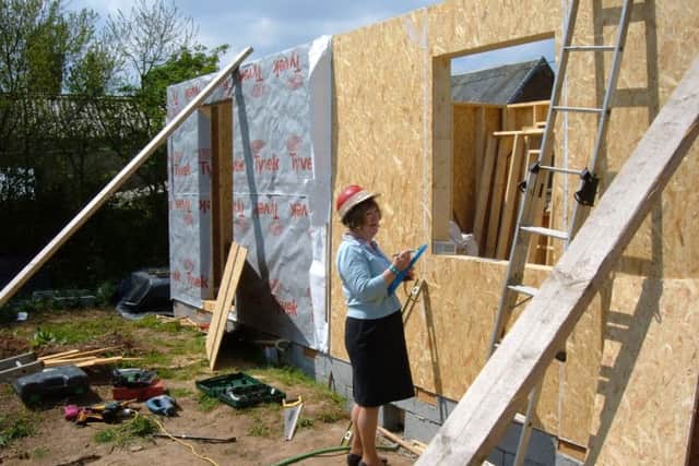 Marie Davis helping out with the house