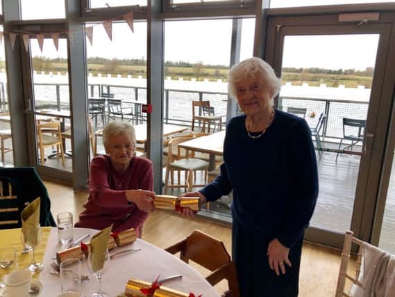 Enjoying the celebrations at Lakeside are June McSparron, left, and Daphne Guthrie.