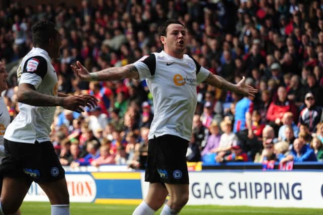 Lee Tomlin celebrates a Posh goal.