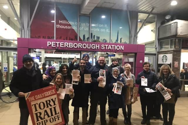 Labour Party members protesting outside Peterborough Station
