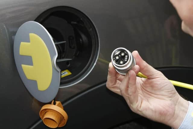 An electric car being charged up.