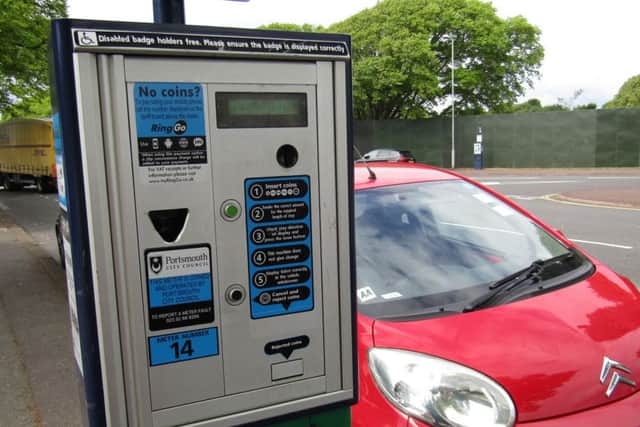 A car parked next to a parking meter