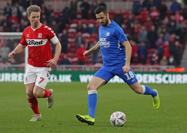 Daniel Lafferty of Peterborough United in action on his debut against Grant Leadbitter of Middlesbrough. Picture: Joe Dent