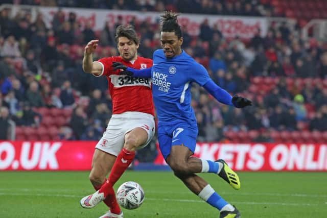 Ivan Toney of Peterborough United in action with George Friend of Middlesbrough. Photo: Joe Dent/theposh.com.