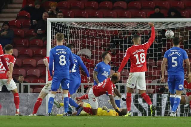 Britt Assombalonga of Middlesbrough (falling) scores his sides opening goal of the game against Posh. Photo: Joe Dent/theposh.com
