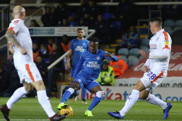 Siriki Dembele in action for Posh against Luton in August.