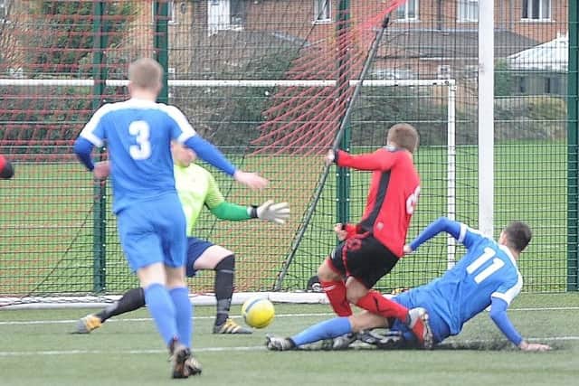 Josh Smith (8) scores for Netherton against Whittlesey. Photo: David Lowndes.