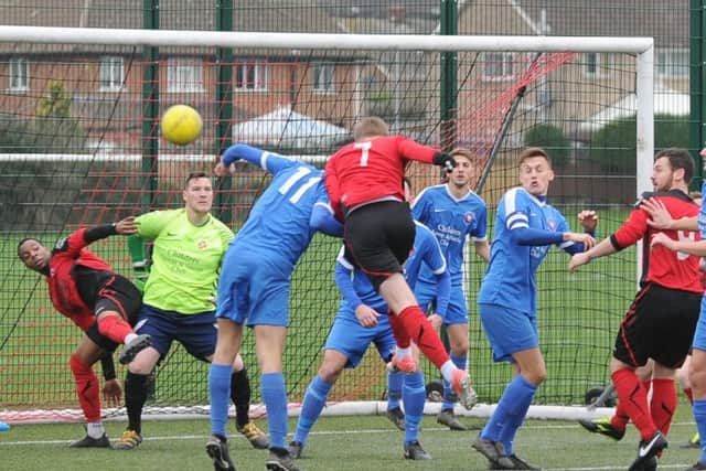 Action from Whittlesy's cup win at Netherton (red). Photo: David Lowndes.