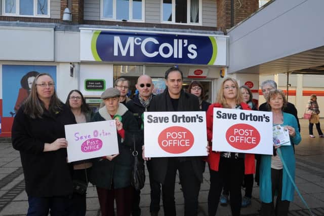 Cllr Julie Howell (front, second from right) demonstrating against the proposed loss of the Post Office at McColl's last year