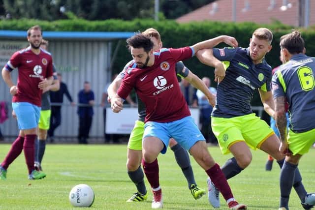 Deeping Rangers (claret) in action.