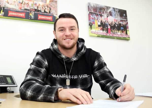 Lee Tomlin signs for Posh. Picture: Joe Dent