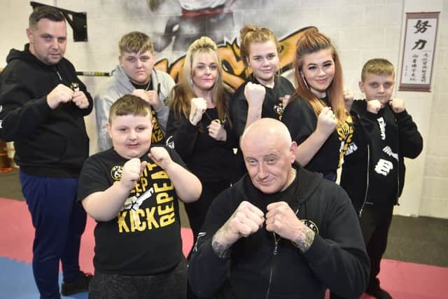 MPSK martial arts Master Ian Parker with his family Neal White, Taylor, Jolene, Shantelle, Shatnella, Jake and Ted (front) Parker-White at the martial arts classes for children with additional needs EMN-190801-184350009