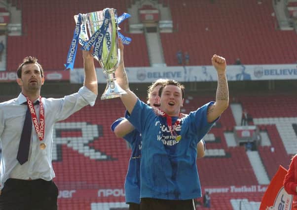 Lee Tomlin (right) celebrates Posh's 2011 League One play-off final win at Old Trafford.