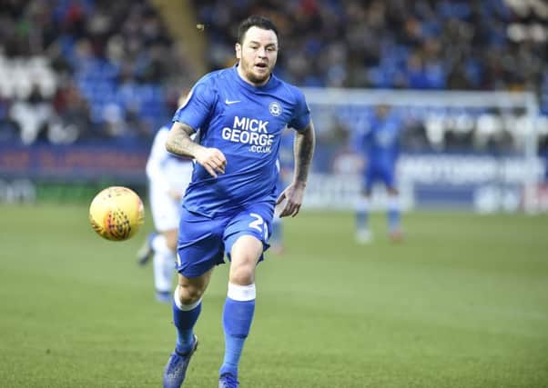 Posh star Lee Tomlin chases a through ball in the win over Rochdale. Photo: David Lowndes.