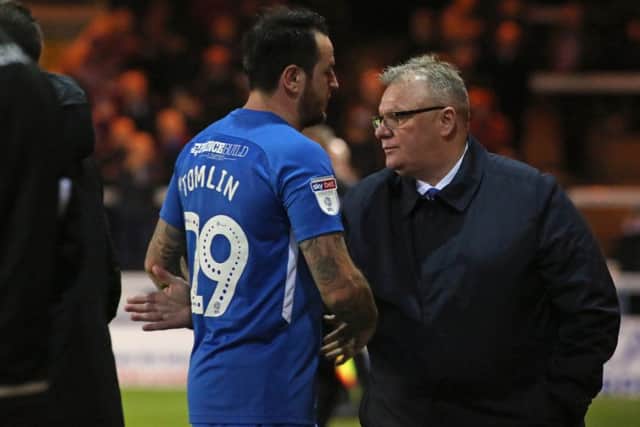 Posh boss Steve Evans congrualtes Lee Tomlin after taking him off against Rochdale. Photo: Joe Dent/theposh.com.