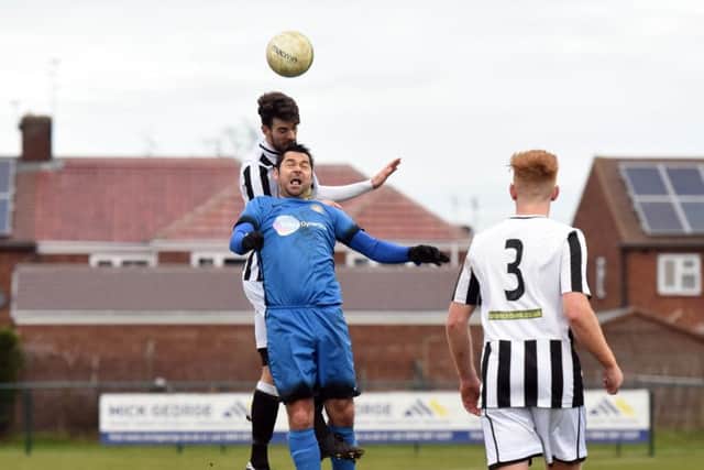 Matthew Cox (stripes) of Peterborough Northern Star in action against Desborough. Photo: Chantelle McDonald. @cmcdphotos