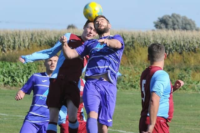 Peterborough NECI (purple) in action earlier this season.